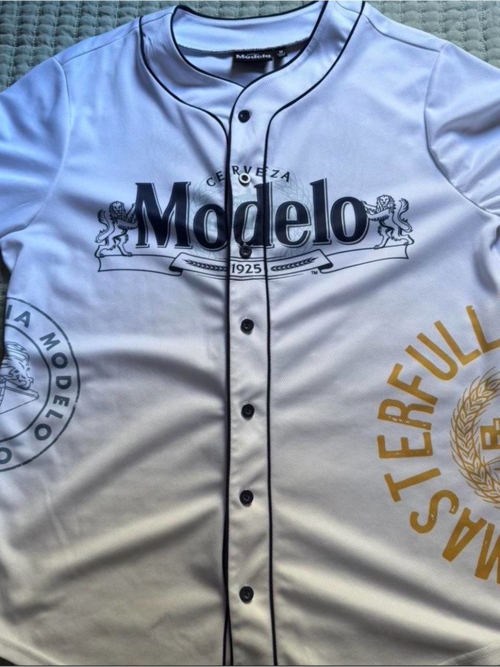 ModelCo White Baseball Jersey with Black and Gold Graphics